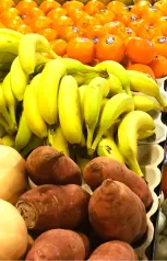 A Cluster Of Ripe Yellow Bananas Arranged Together On A White Background