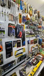 A Store Interior Displaying Various Tools And Items Neatly Arranged On The Walls