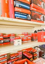 A Store Interior Filled With Various Car Parts Displayed On Shelves And Racks
